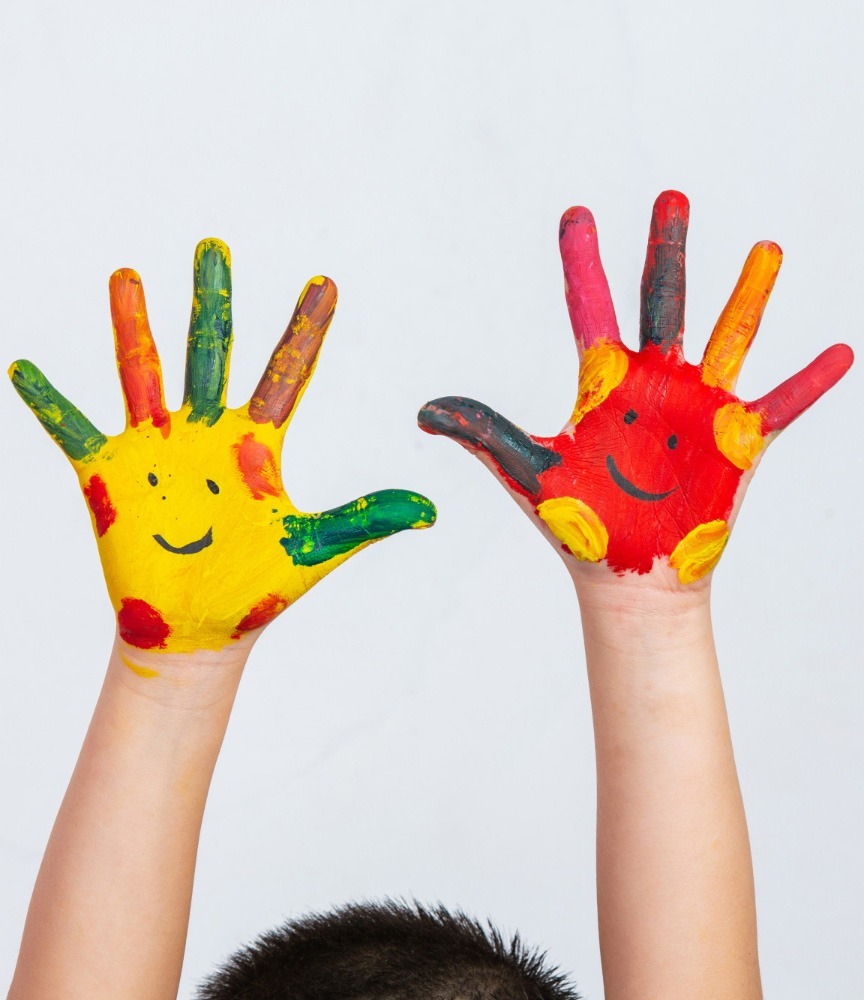 Painted hands with a smiley face